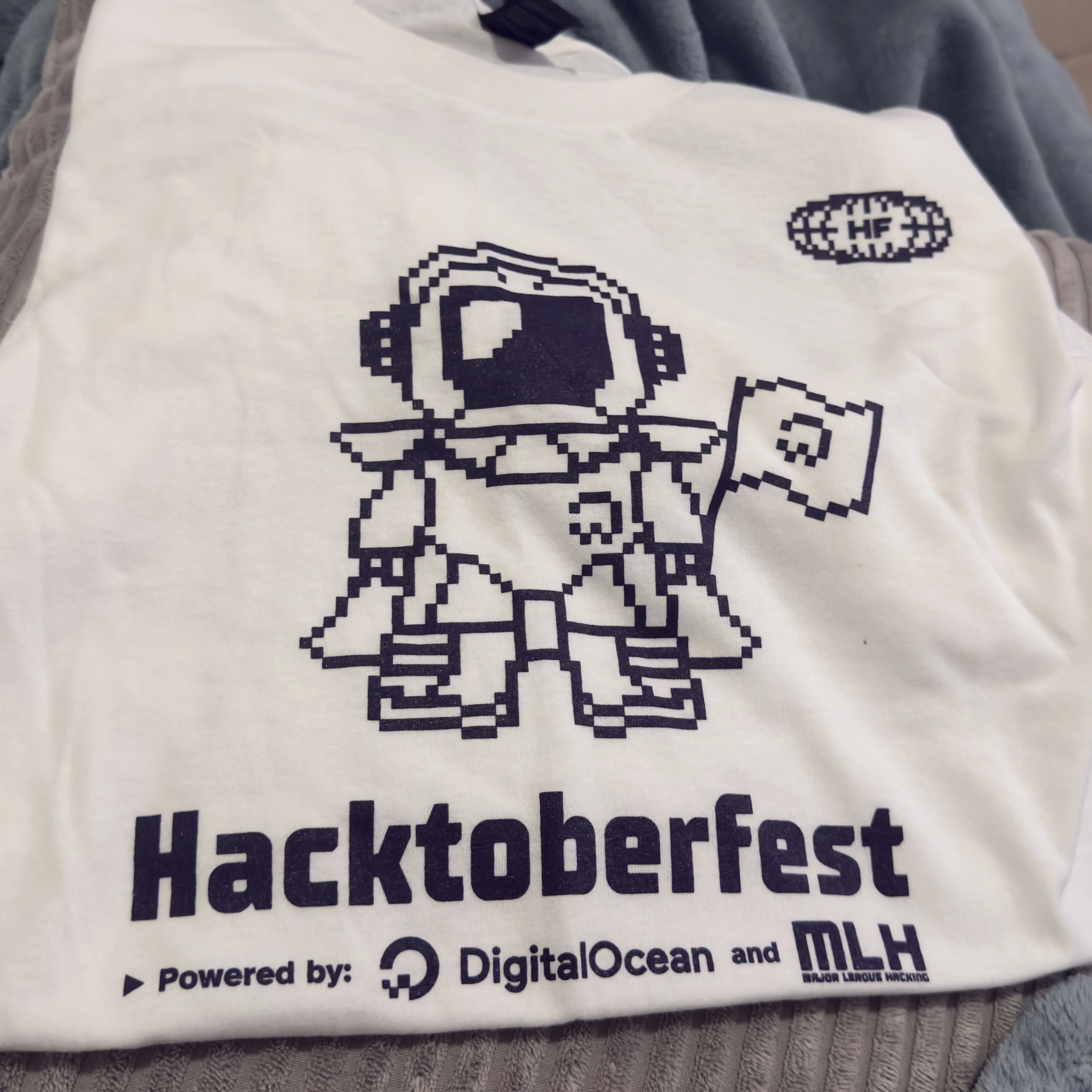 Hacktoberfest 2025 supercontributor shirt in light color, representing the limited edition reward for top contributors